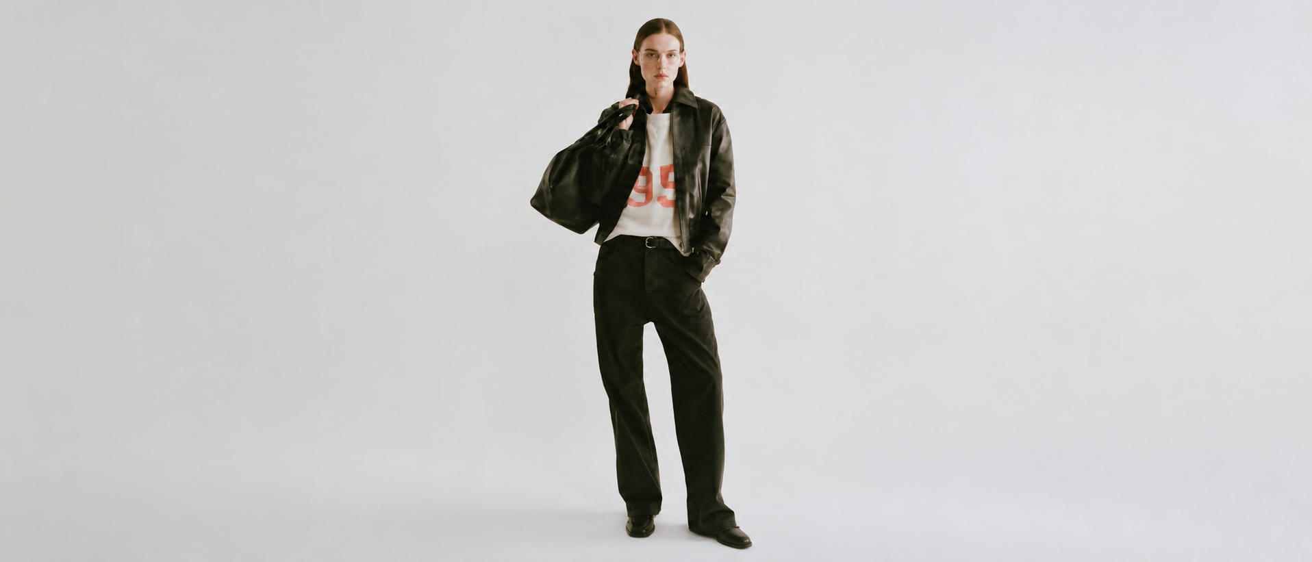 Refined layered womenswear in a modern editorial style